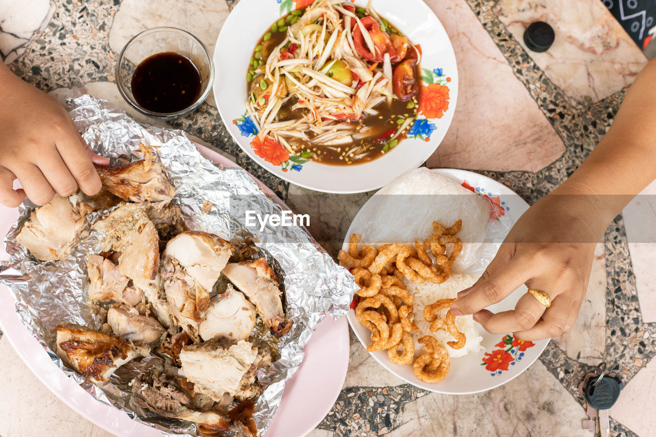 High angle view of woman holding food