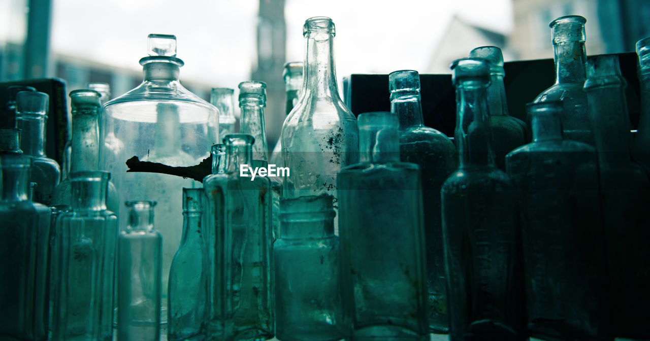 Close-up of various glass bottles on table