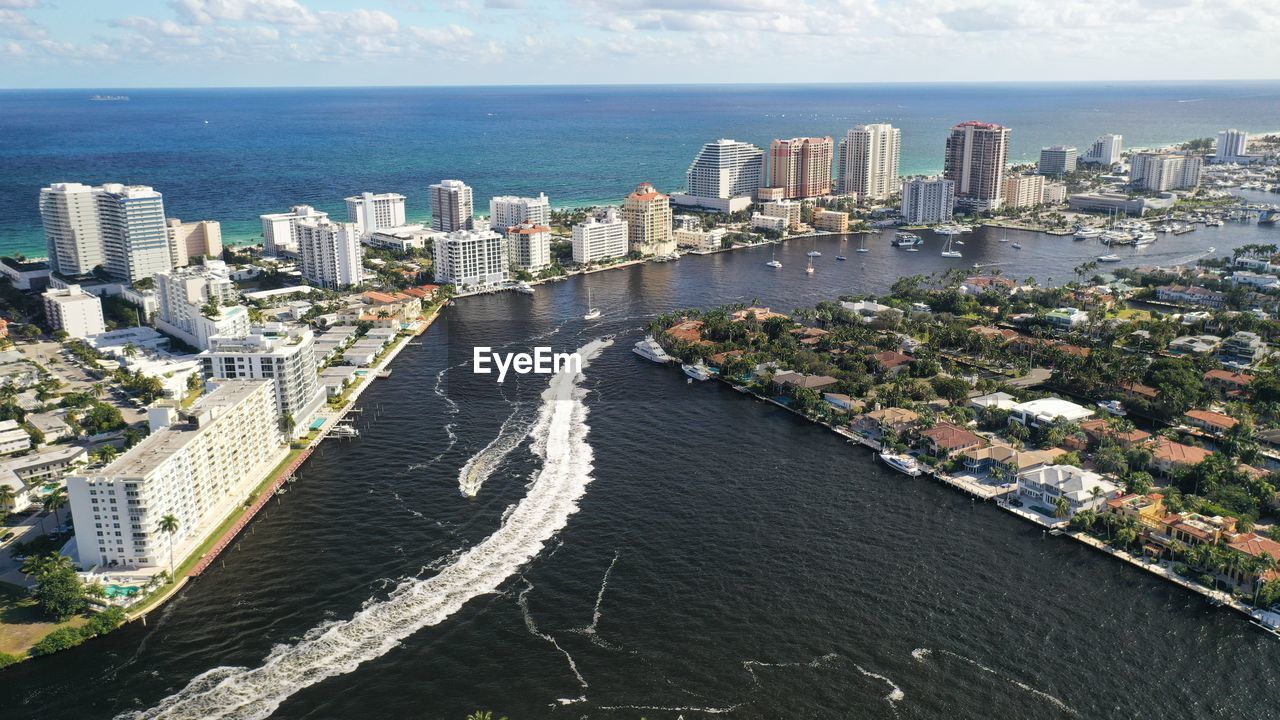 HIGH ANGLE VIEW OF BAY AND BUILDINGS IN CITY