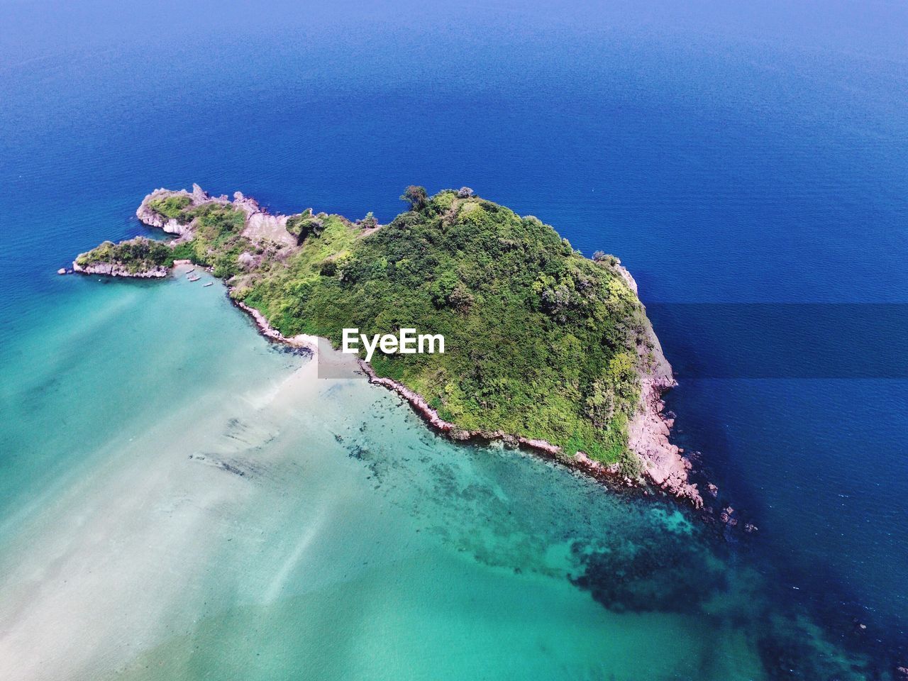 High angle view of sea against blue sky