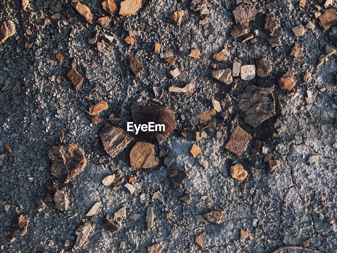 High angle view of stones on field