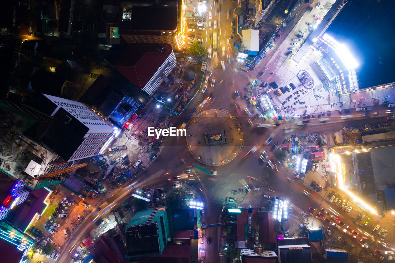 HIGH ANGLE VIEW OF ILLUMINATED CITY BUILDINGS