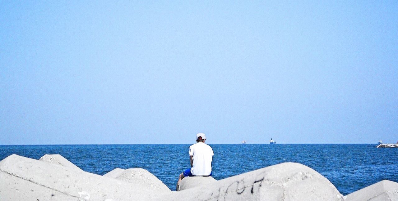 Scenic view of calm sea against clear sky