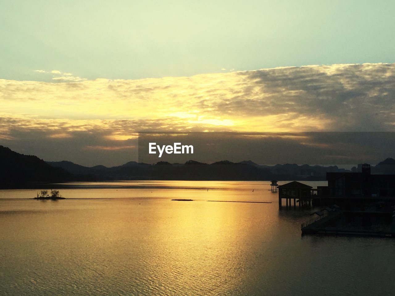 Scenic view of sea against sky at sunset