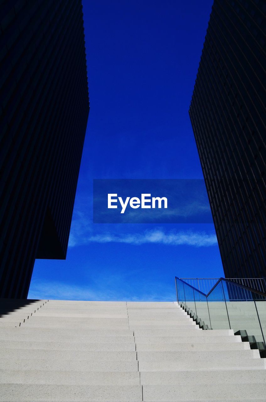 Low angle view of building against blue sky