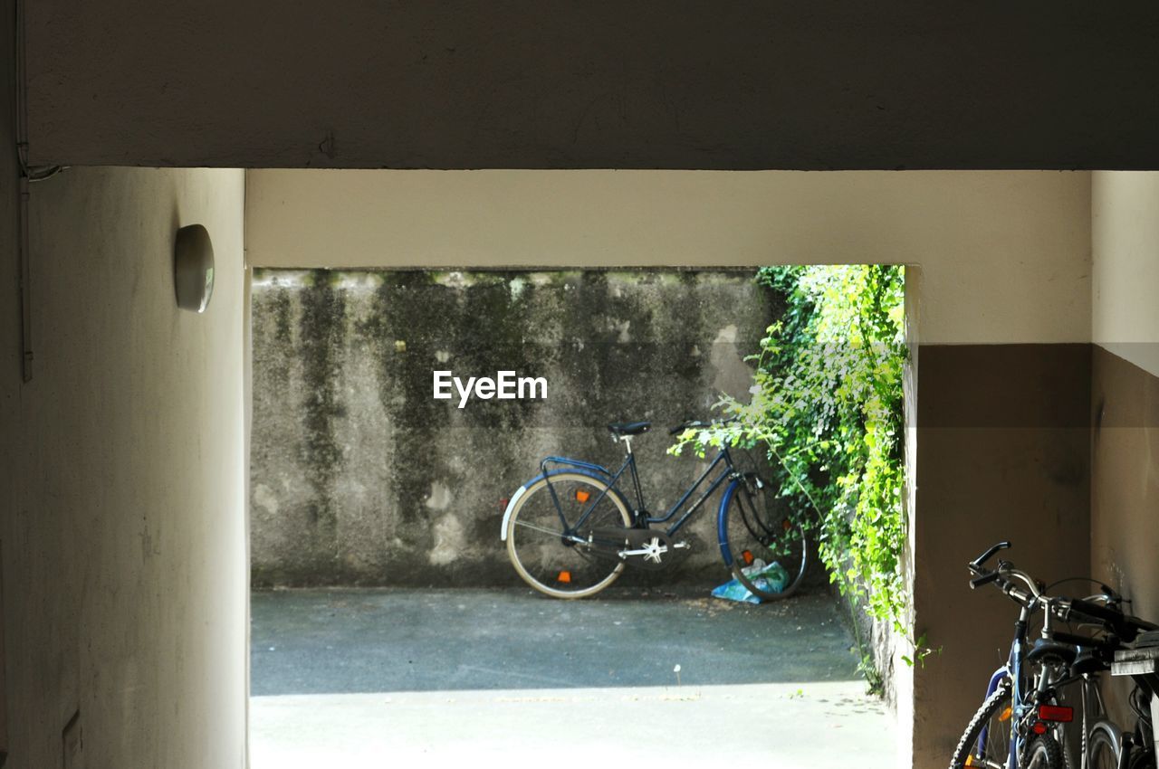 BICYCLE PARKED ON WALL