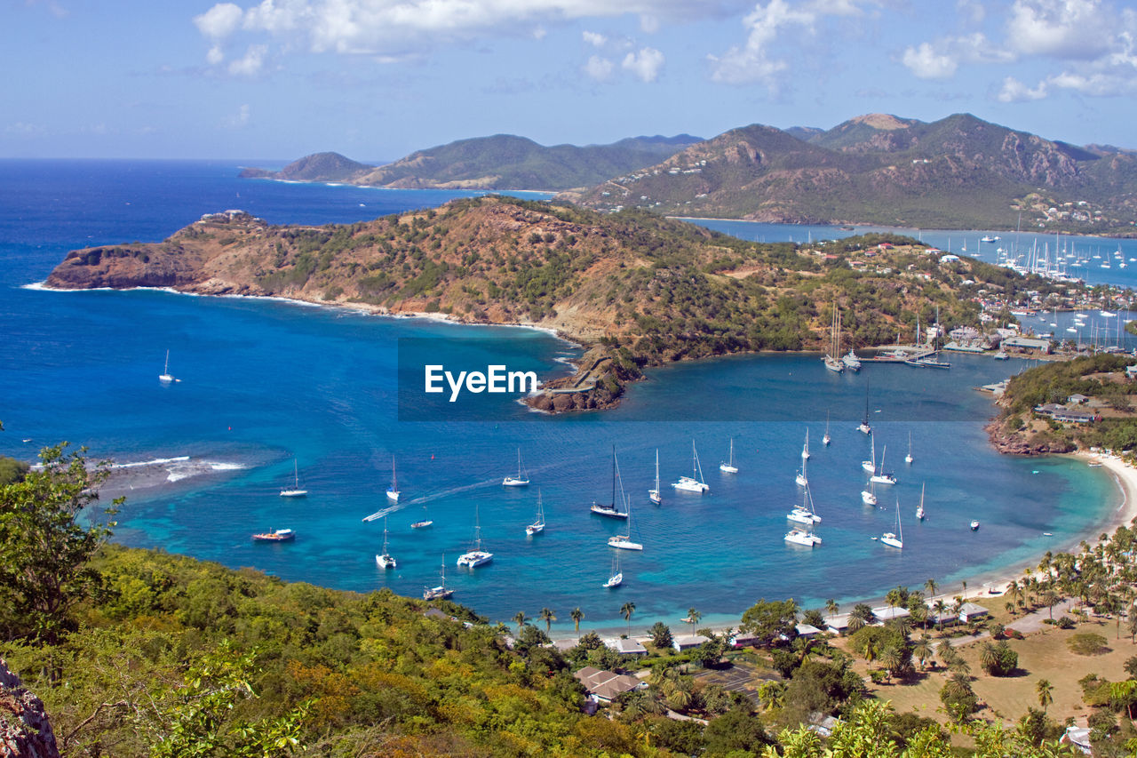 High angle view of st john's harbor boats on sea shore against sky