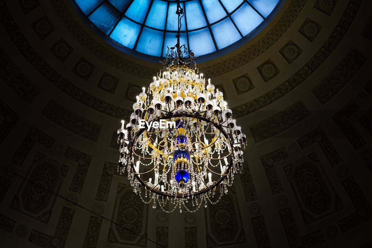 Low angle view of chandelier hanging from ceiling