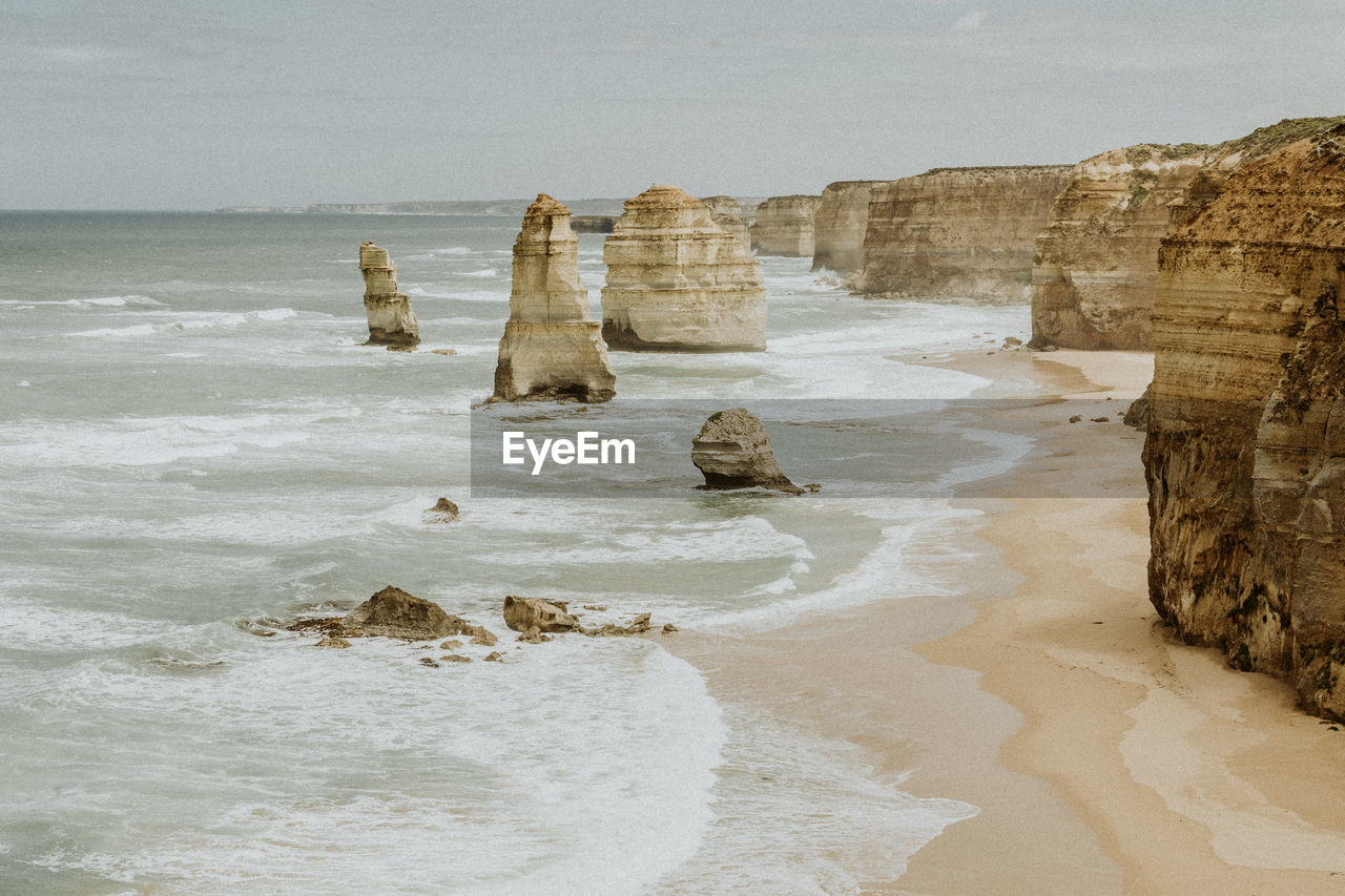 ROCKS ON SHORE AGAINST SEA