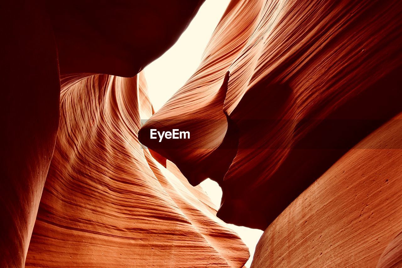 LOW ANGLE VIEW OF ROCK FORMATION AT THE CANYON