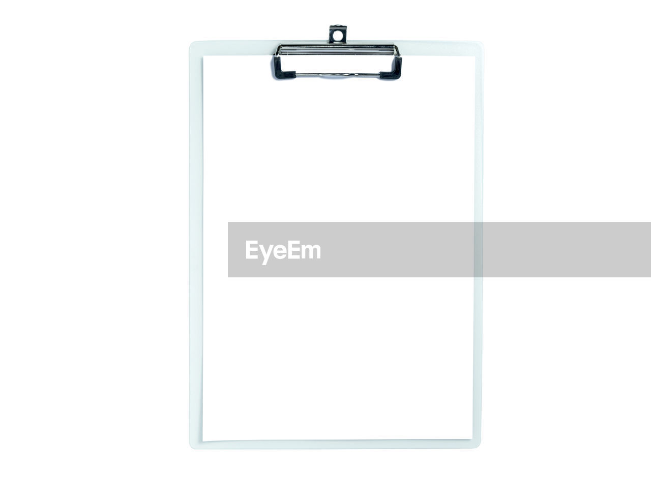 Close-up of paper with clipboard against white background