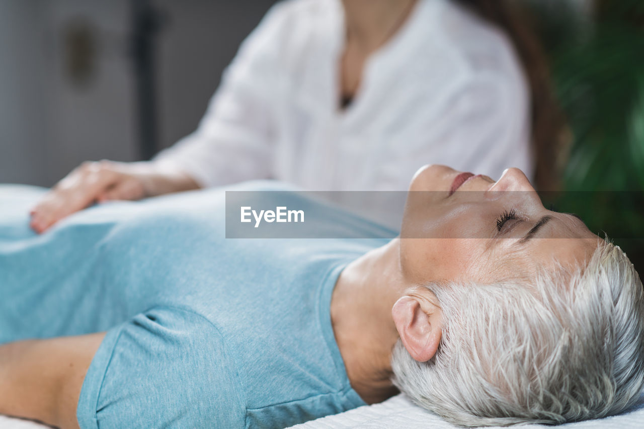 Close-up of woman getting massage at spa