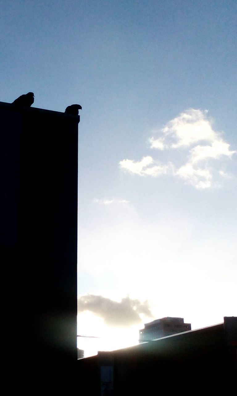 LOW ANGLE VIEW OF BUILT STRUCTURES AGAINST SKY