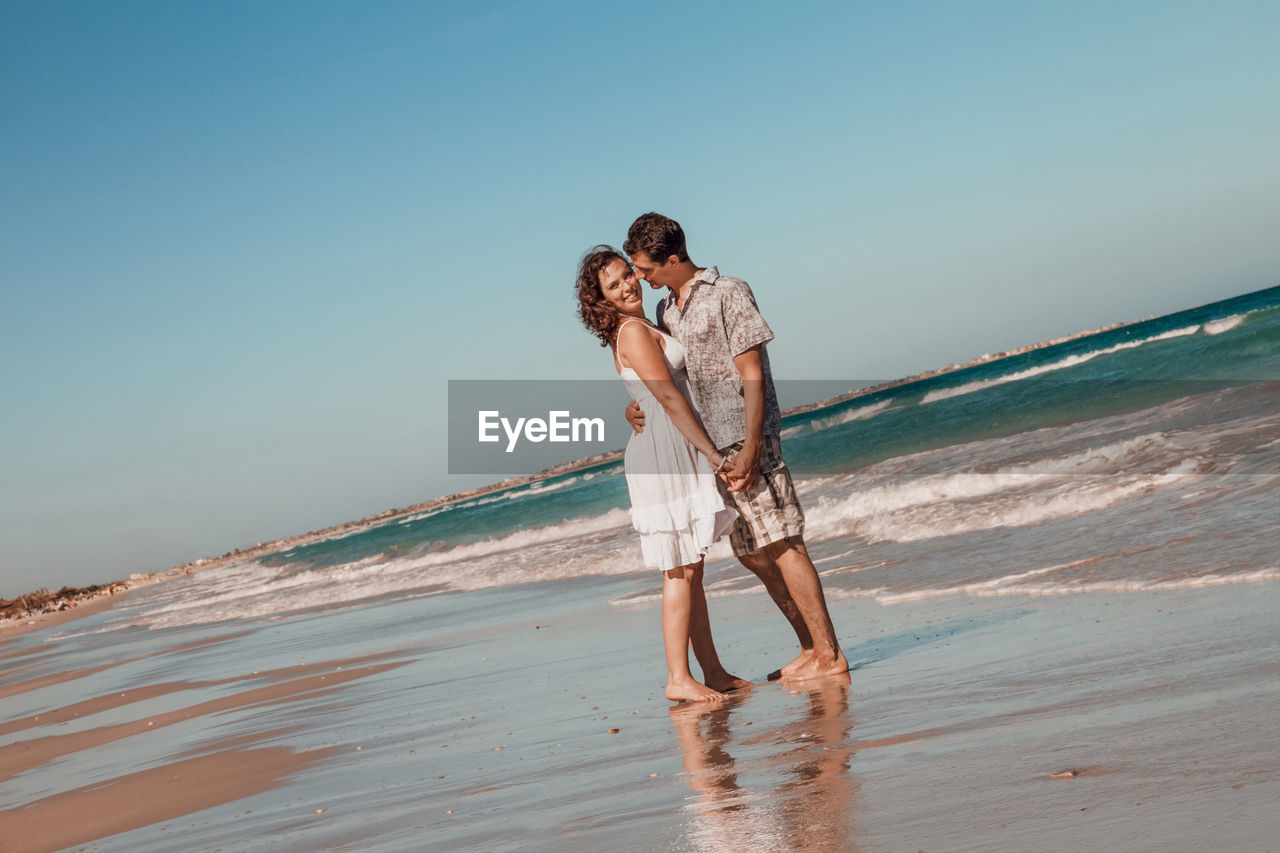 Young couple embracing at beach