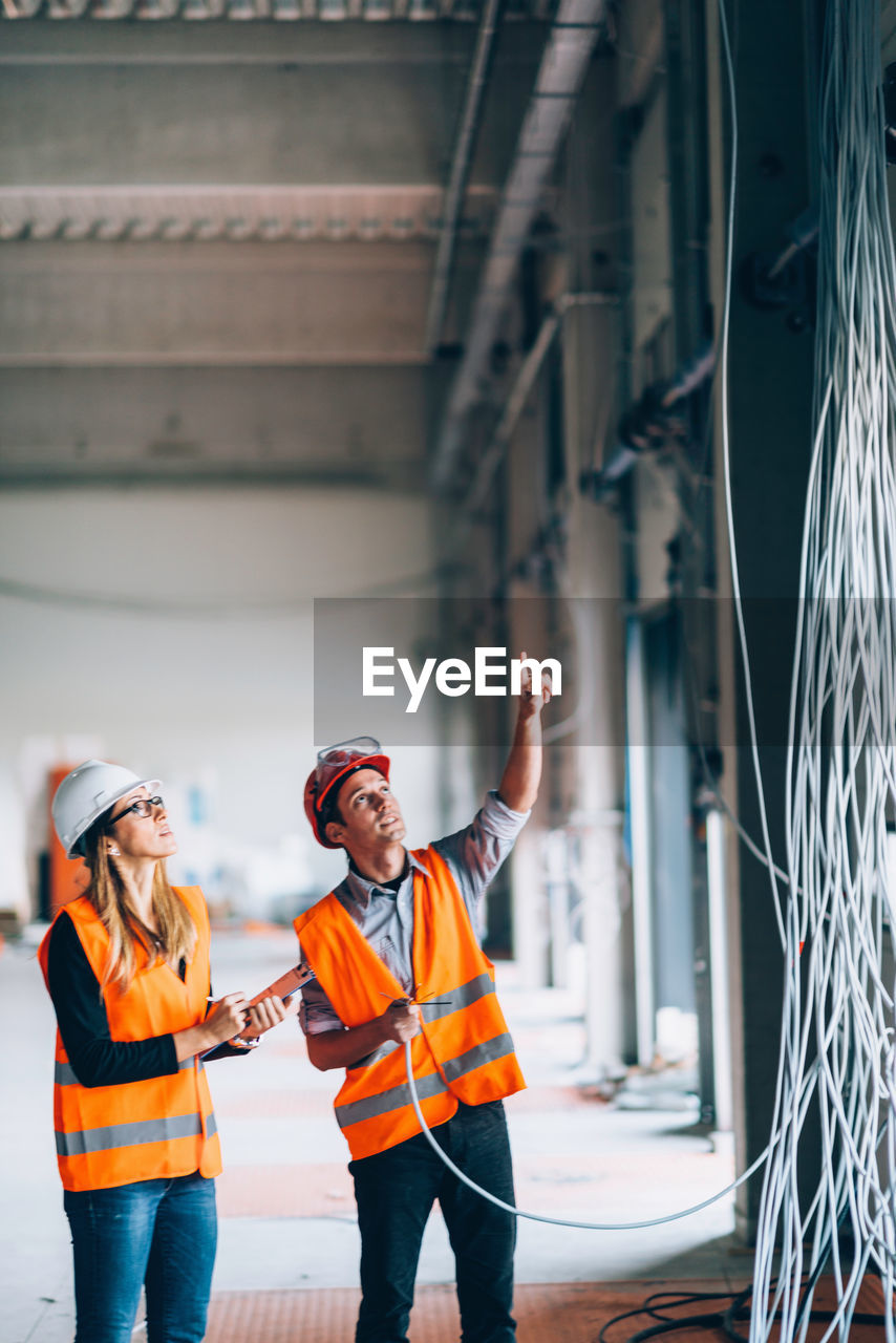 Architects examining cables at site