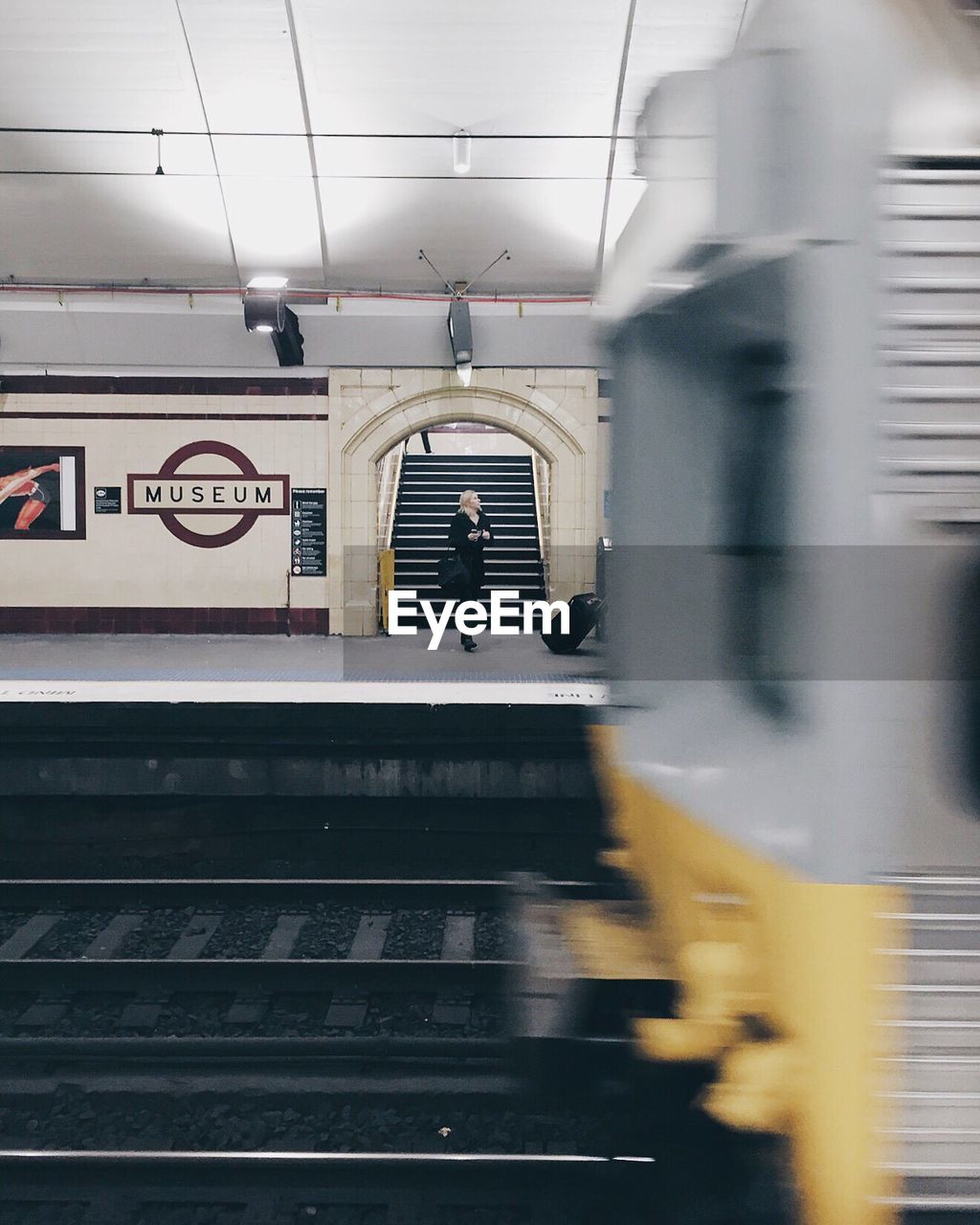 TRAIN ON RAILROAD STATION PLATFORM