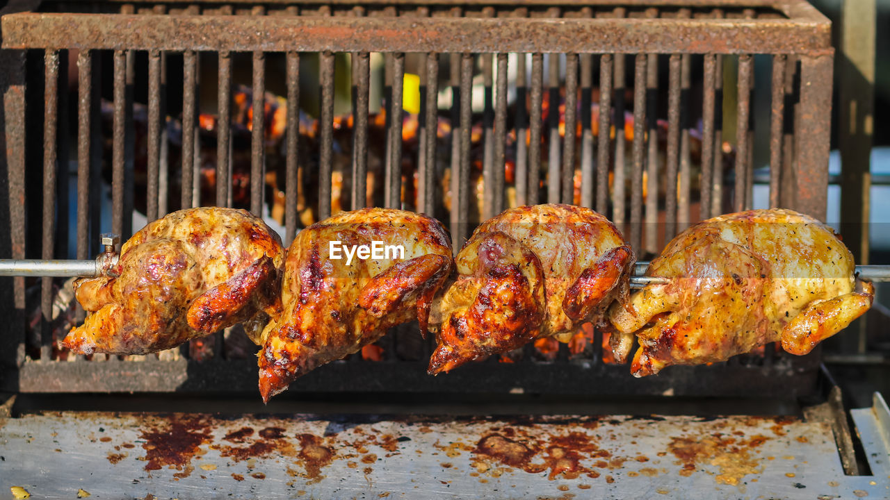 CLOSE-UP OF MEAT ON BARBECUE