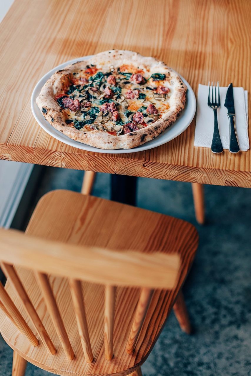 High angle view of fresh chicken pizza on table