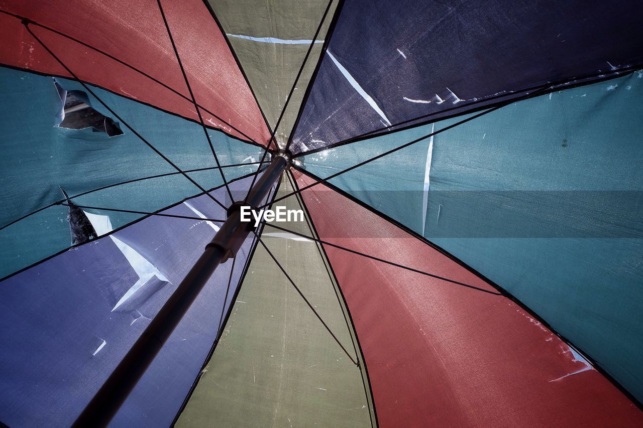 Full frame shot of torn colorful umbrella