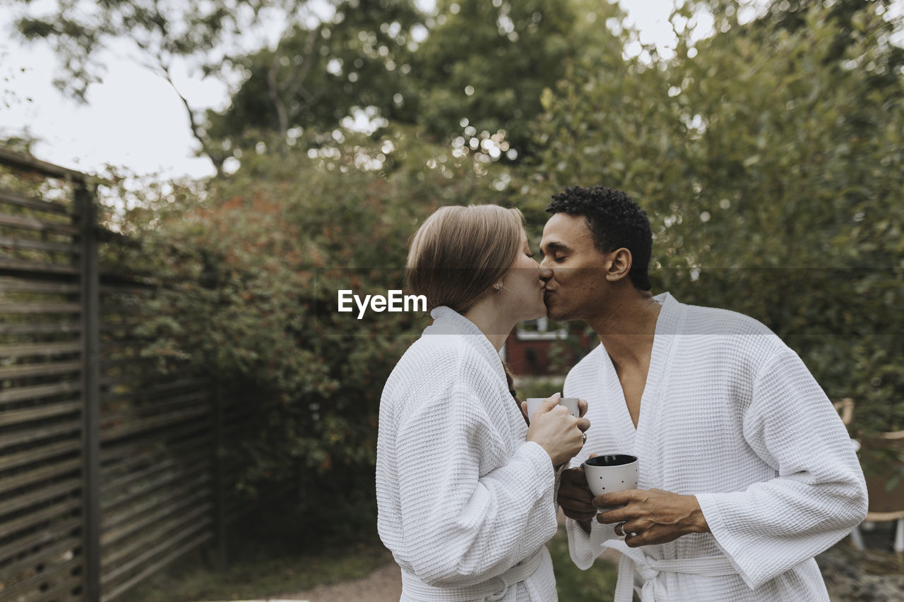 Couple kissing in garden