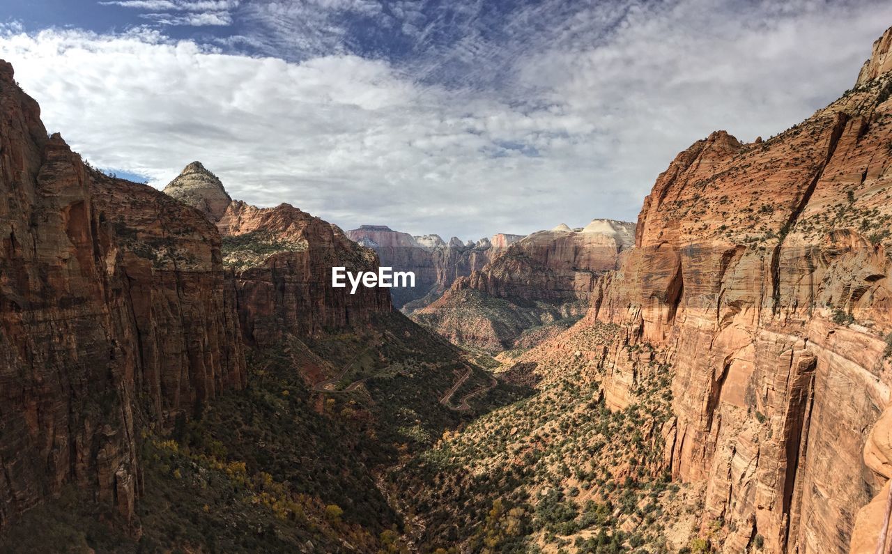 Scenic view of rocky mountains at zion national park against sky