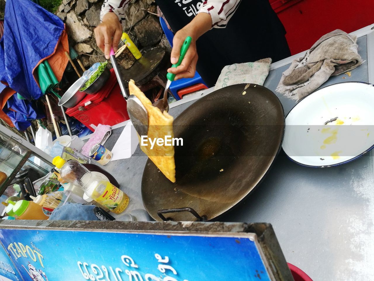 LOW SECTION OF WOMAN WORKING ON FOOD