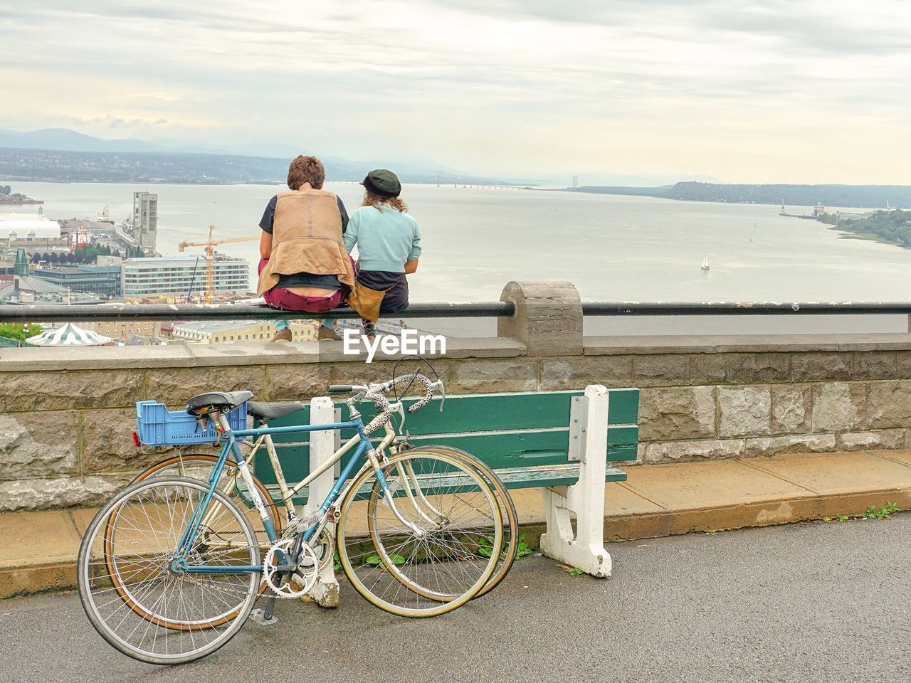 Rear view of couple overlooking river