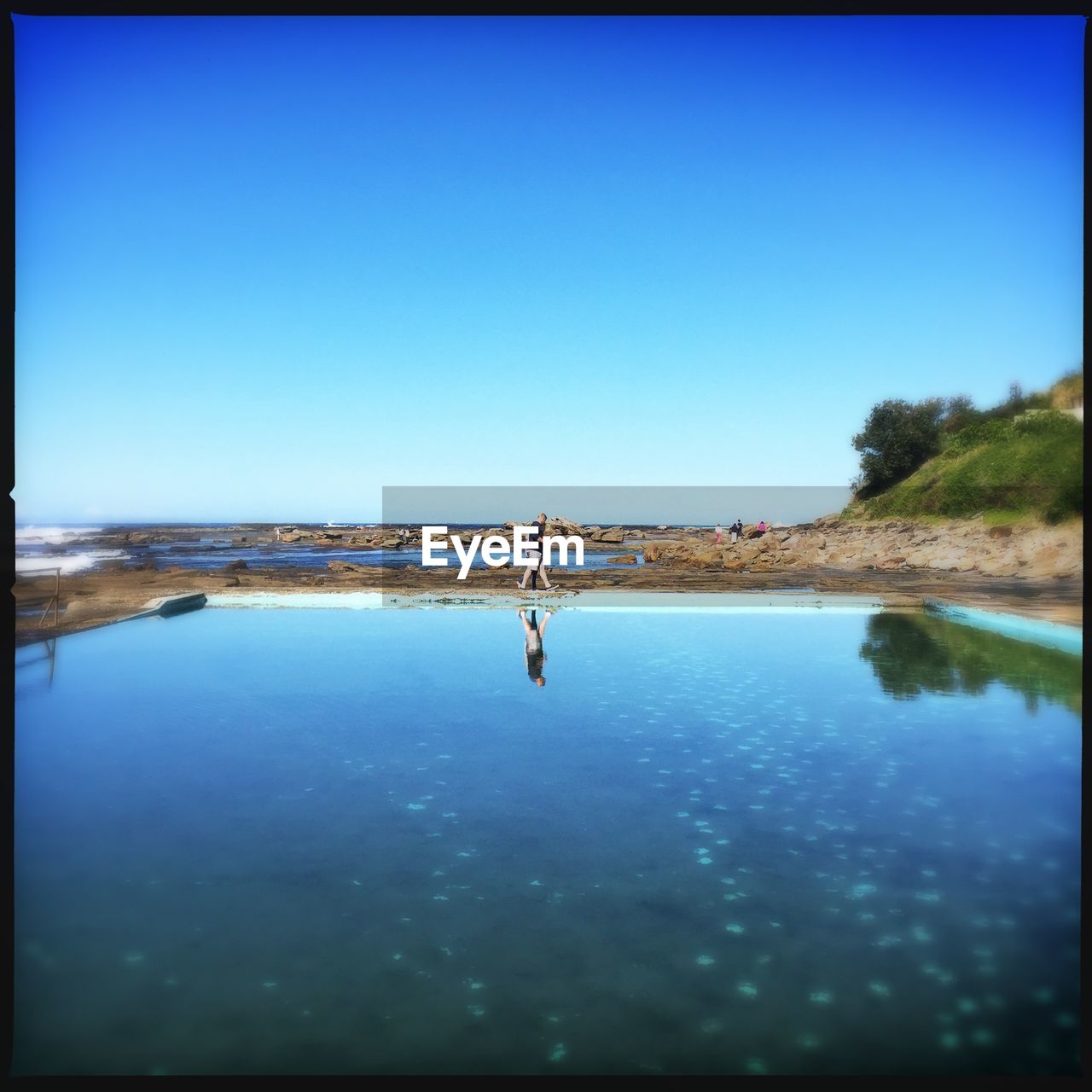 SCENIC VIEW OF CALM SEA AGAINST CLEAR SKY