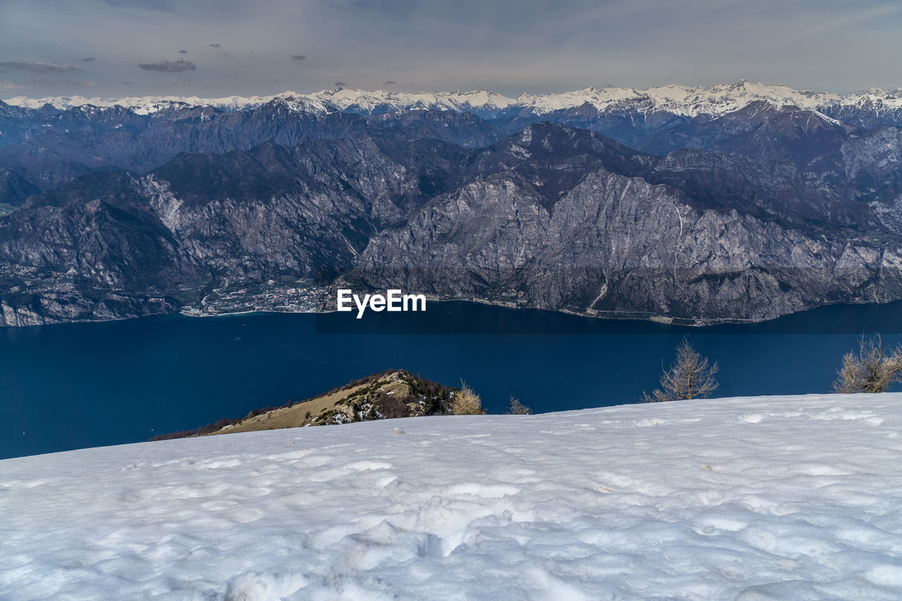 Scenic view of snowcapped mountains against sky during winter