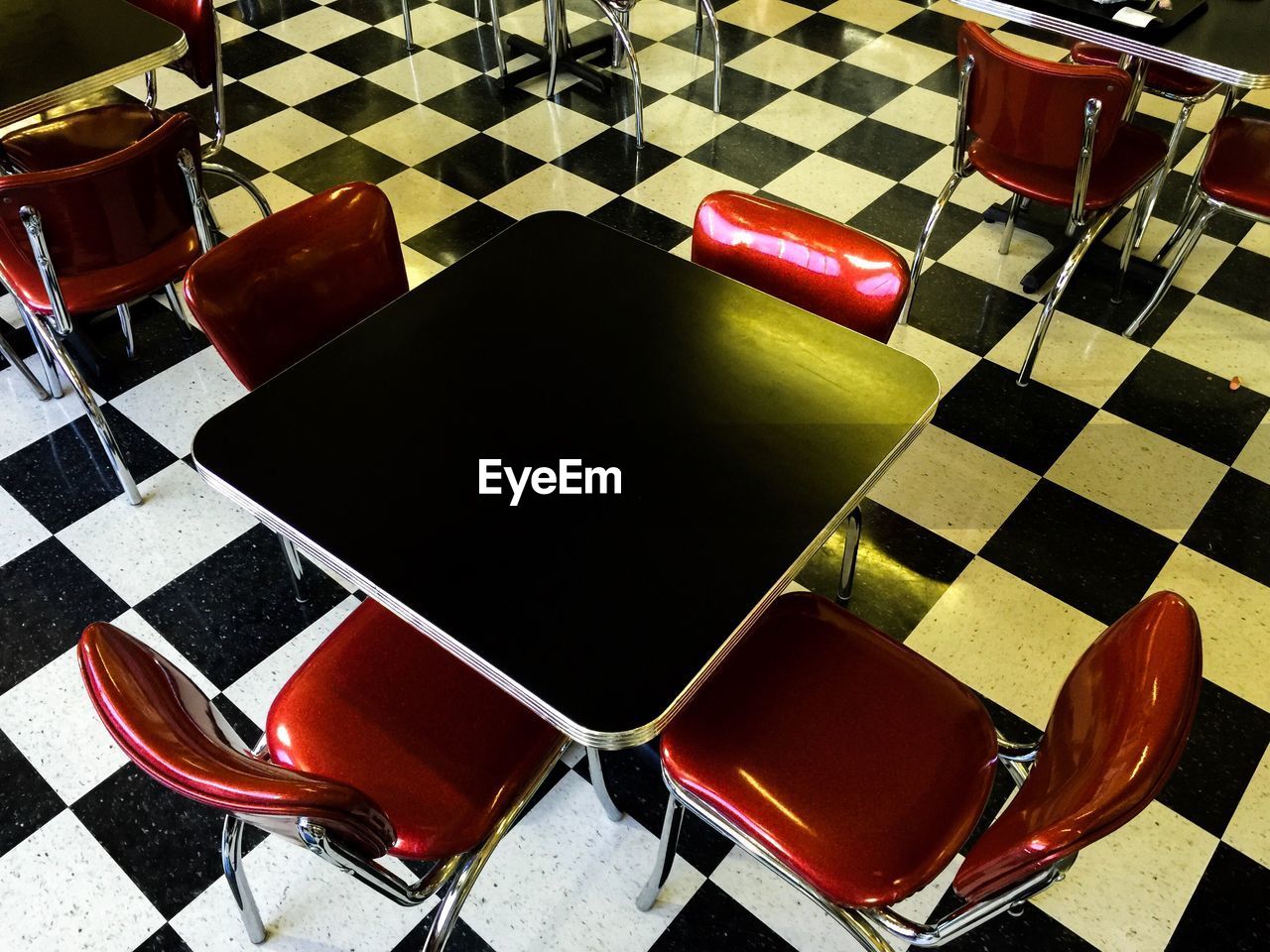 HIGH ANGLE VIEW OF CHAIRS AND TABLE ON FLOOR