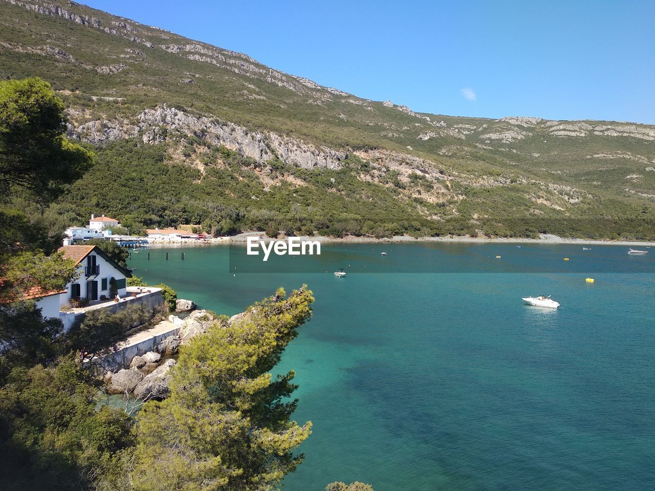 High angle view of sea and buildings against sky