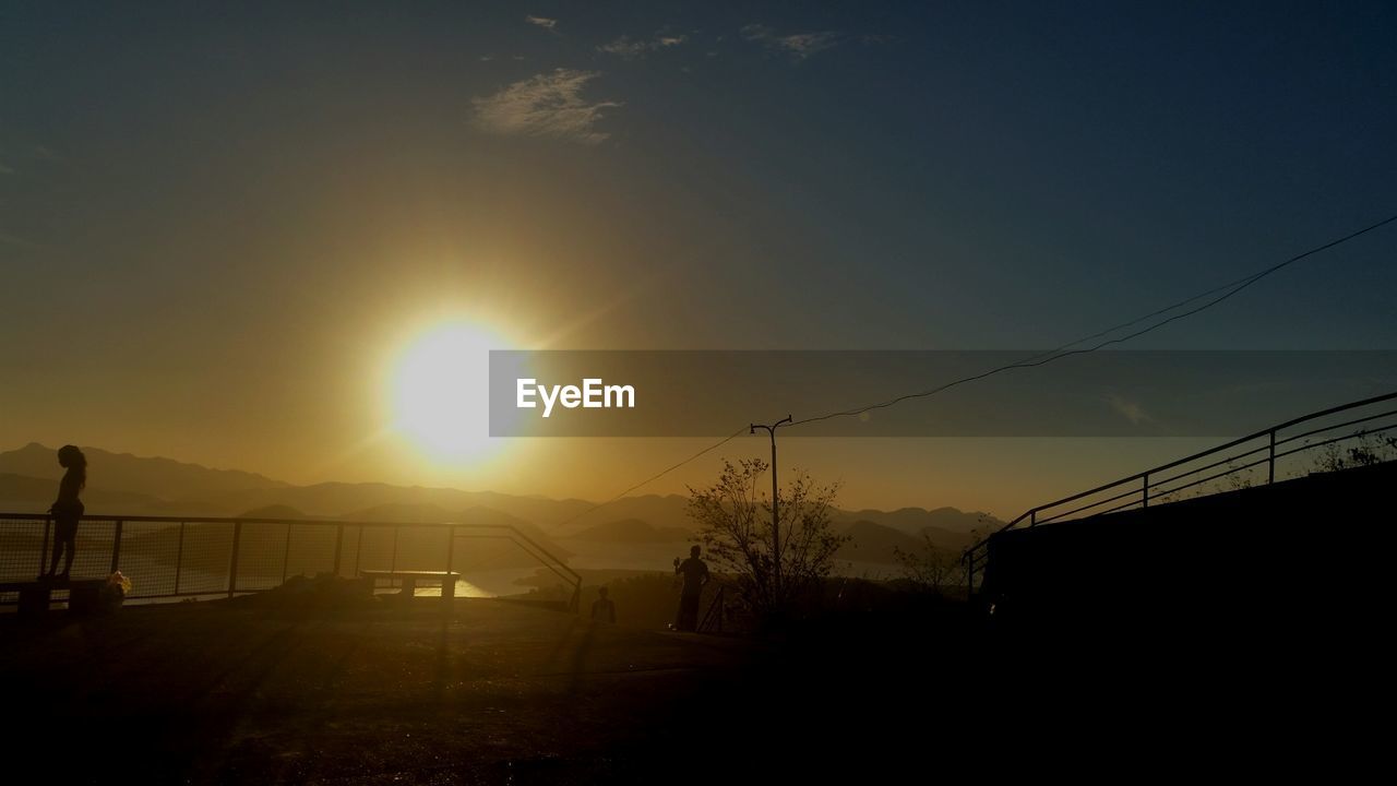 Scenic view of landscape against sky during sunrise