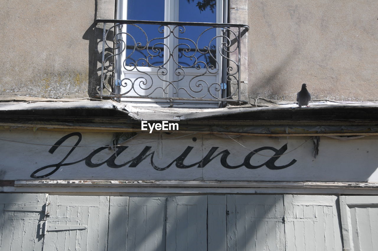 LOW ANGLE VIEW OF GRAFFITI ON BUILDING