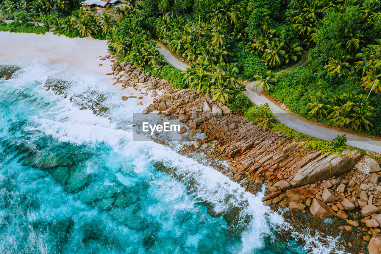 HIGH ANGLE VIEW OF WATER FLOWING IN SUNLIGHT