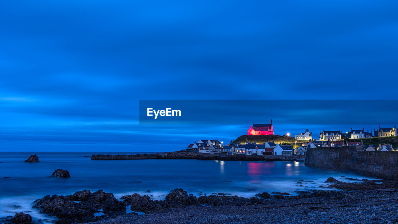 The red church in findochty on high land overlooking the small fishing village on the moray coast