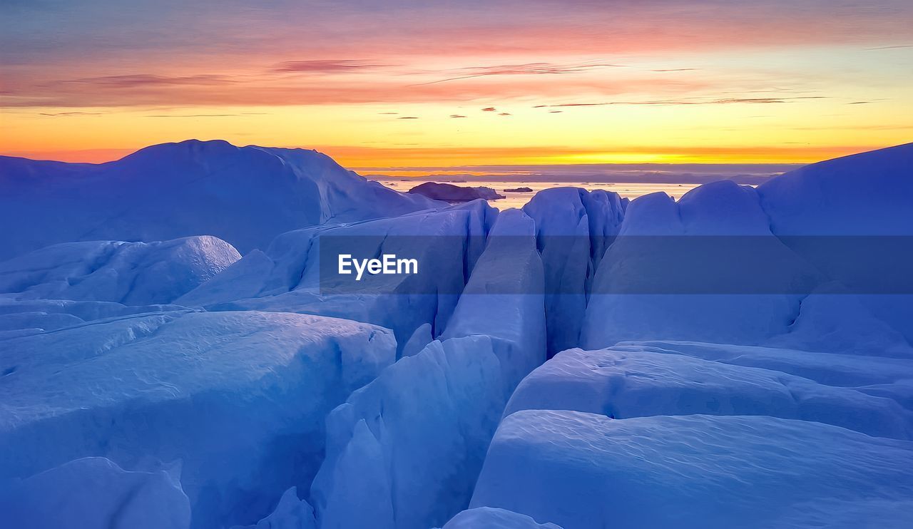 Iceberg floating in greenland fjord.