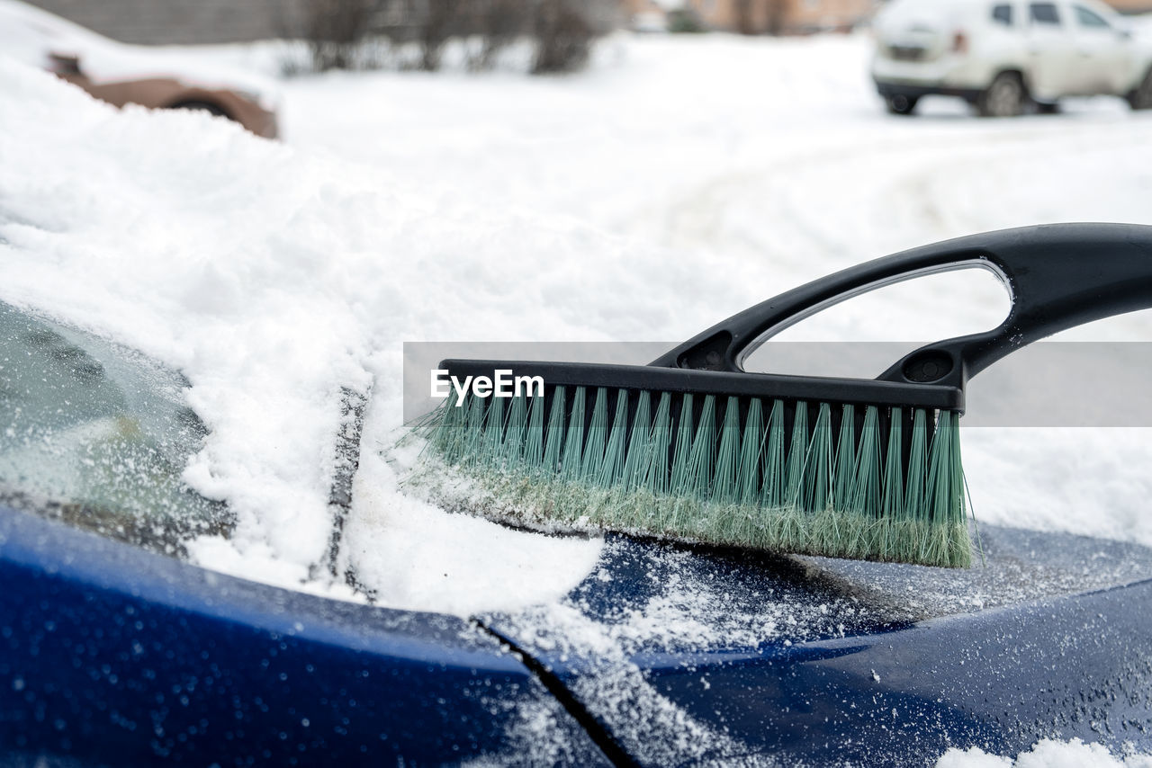 cleaning, car, snow, motor vehicle, winter, cold temperature, mode of transportation, transportation, freezing, nature, washing, water, vehicle, broom, housework, soap sud, environment, motion, land vehicle, automotive exterior, hygiene, tire, windshield, cleaning equipment, scrubbing, storm, outdoors, chores