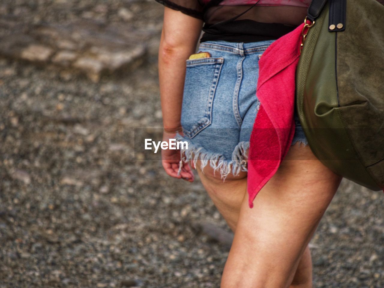 Low section of woman walking outdoors