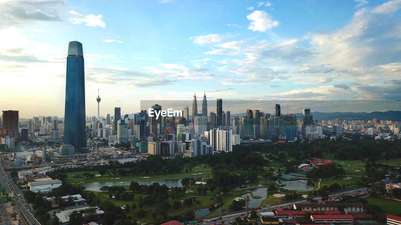 PANORAMIC VIEW OF BUILDINGS IN CITY AGAINST SKY