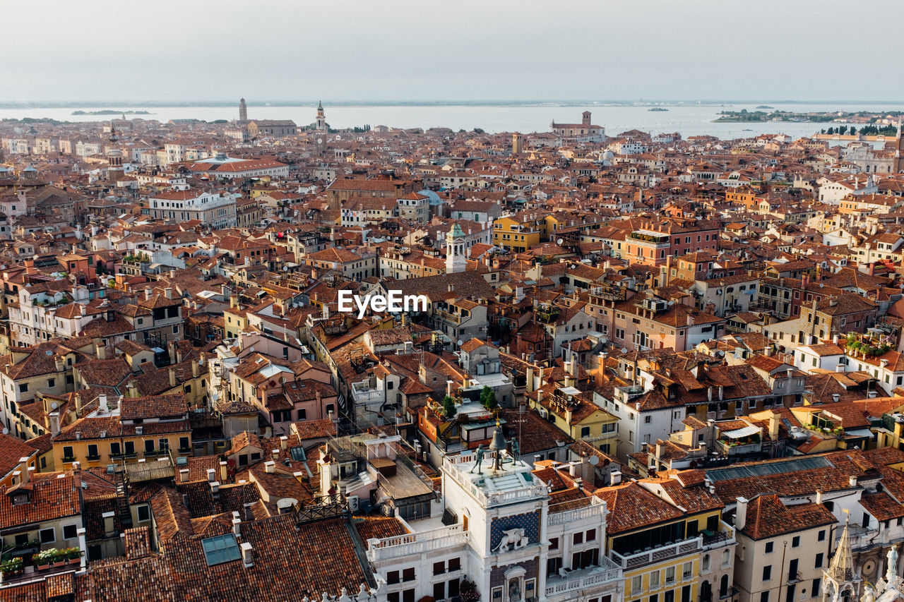 Townscape and sea against sky