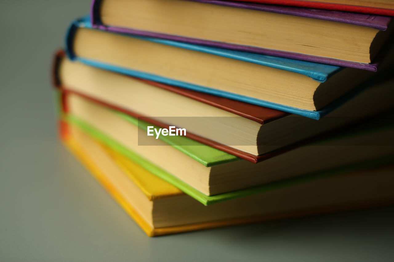 book, publication, education, learning, indoors, wisdom, no people, literature, hardcover book, large group of objects, multi colored, still life, studio shot, document, intelligence, close-up, studying, textbook, order, expertise, library