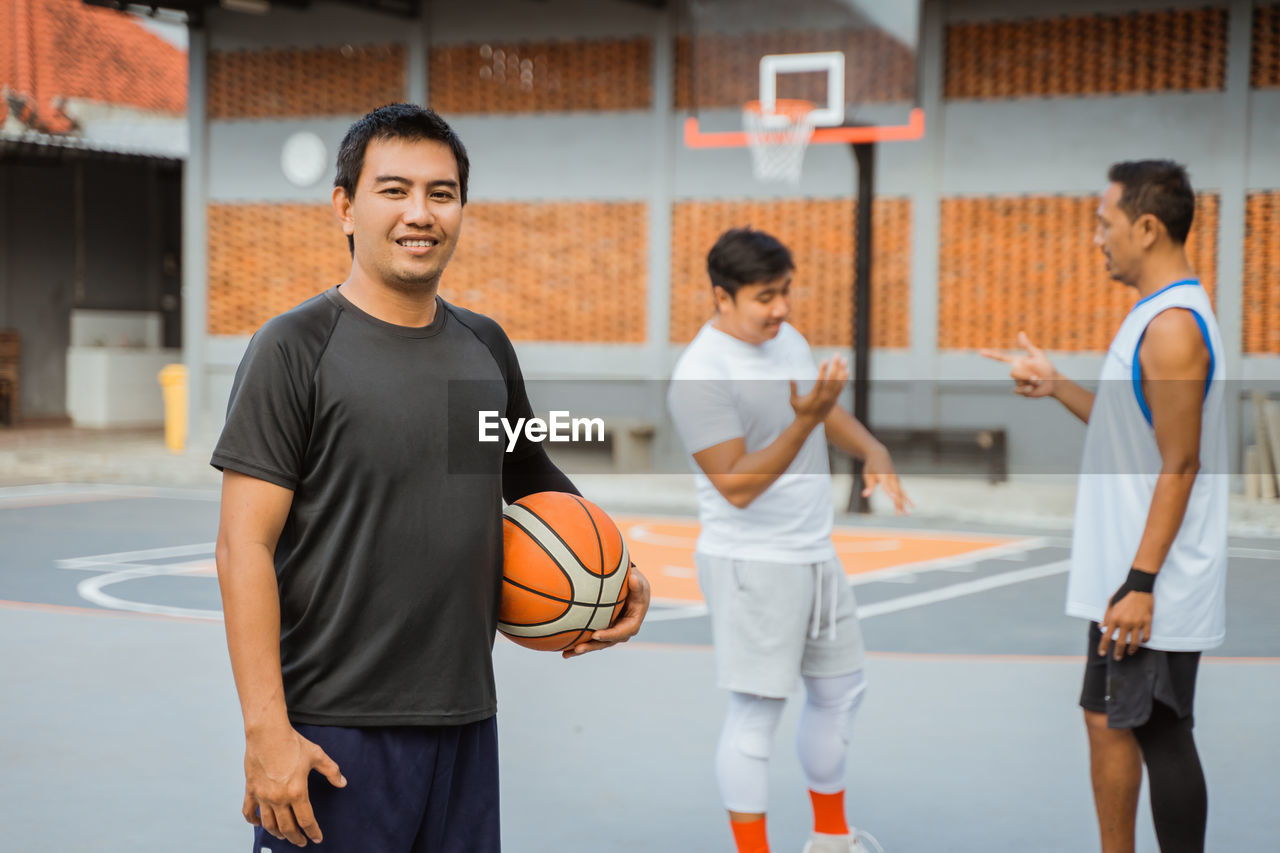 People standing on basketball court