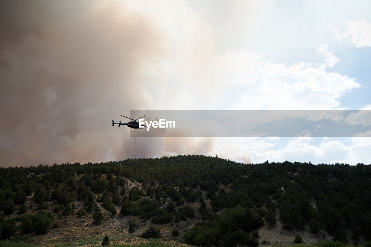 LOW ANGLE VIEW OF AIRSHOW AGAINST SKY