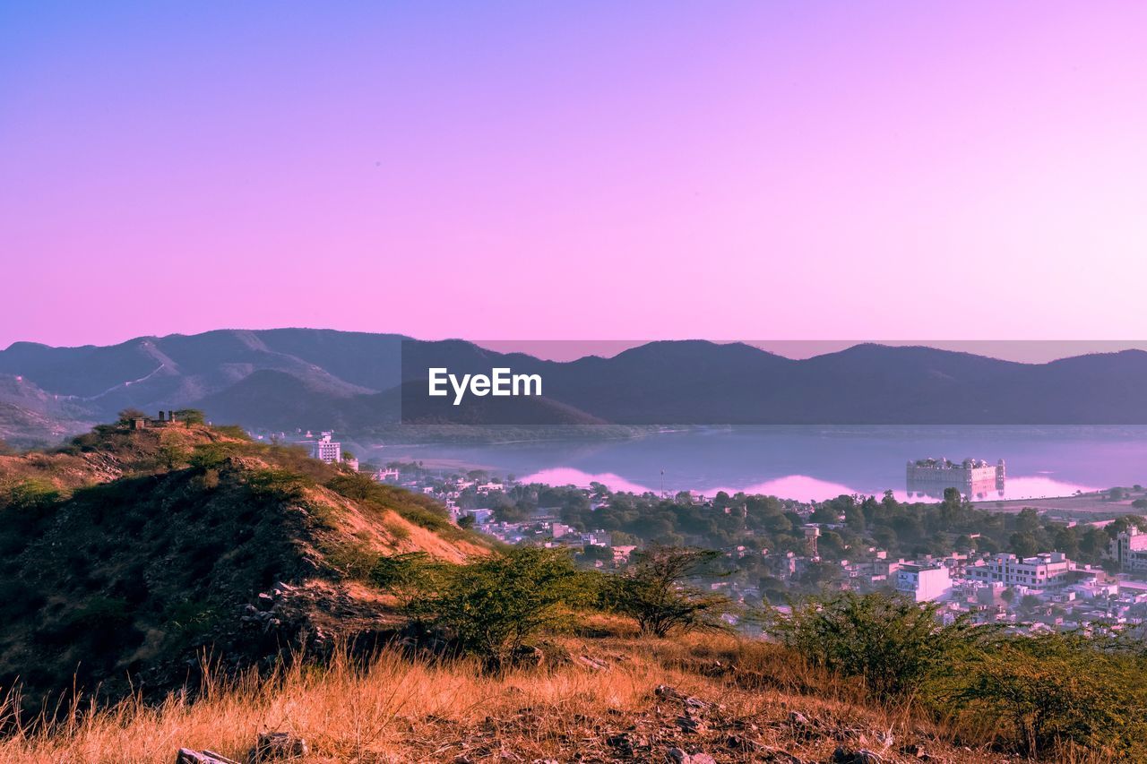 SCENIC VIEW OF MOUNTAINS AGAINST SKY DURING SUNSET