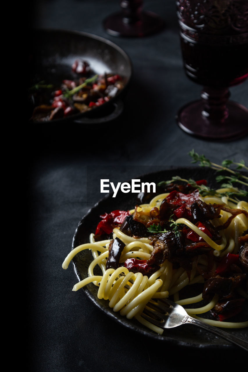 Cooked pasta dish on dark background 