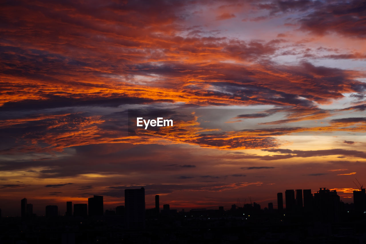 Silhouette landscape against scenic sky