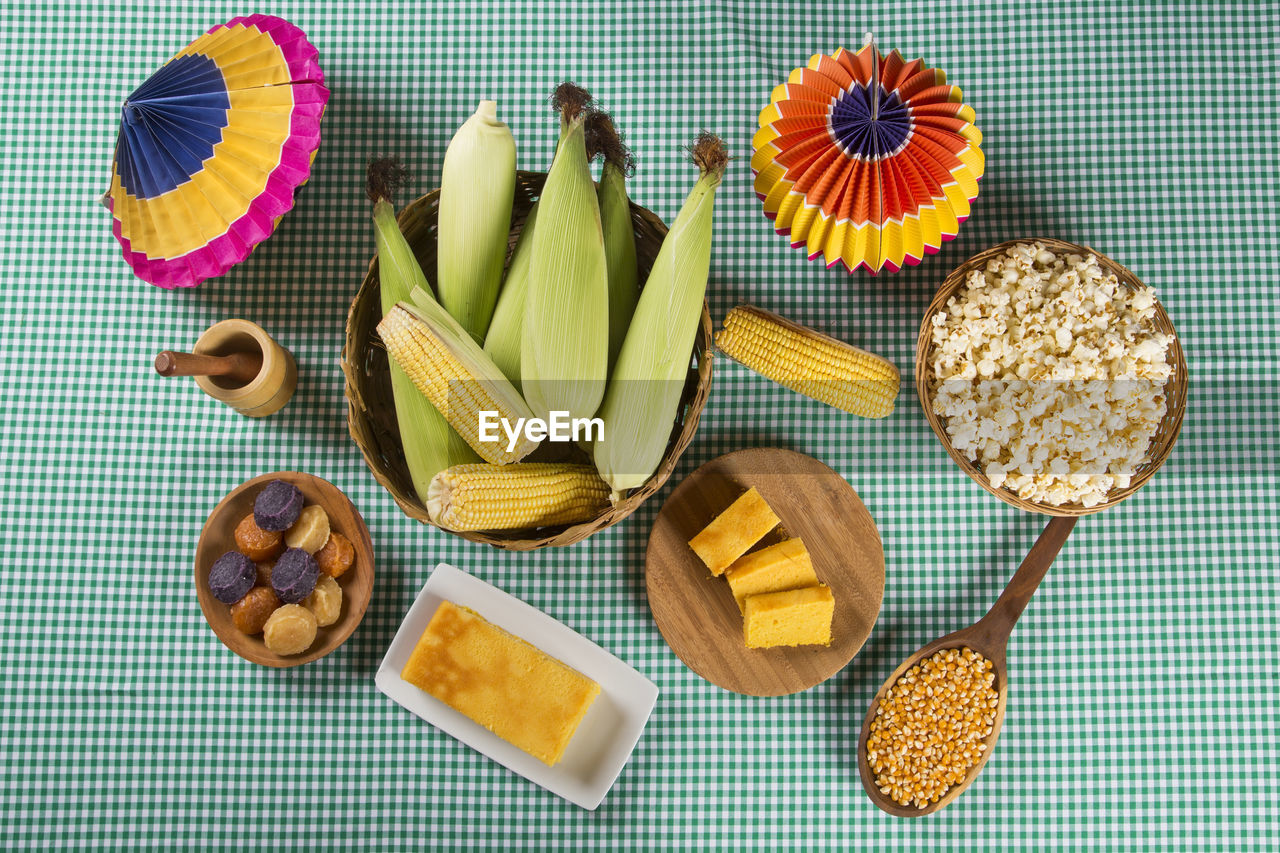 Close-up of corns and food on table