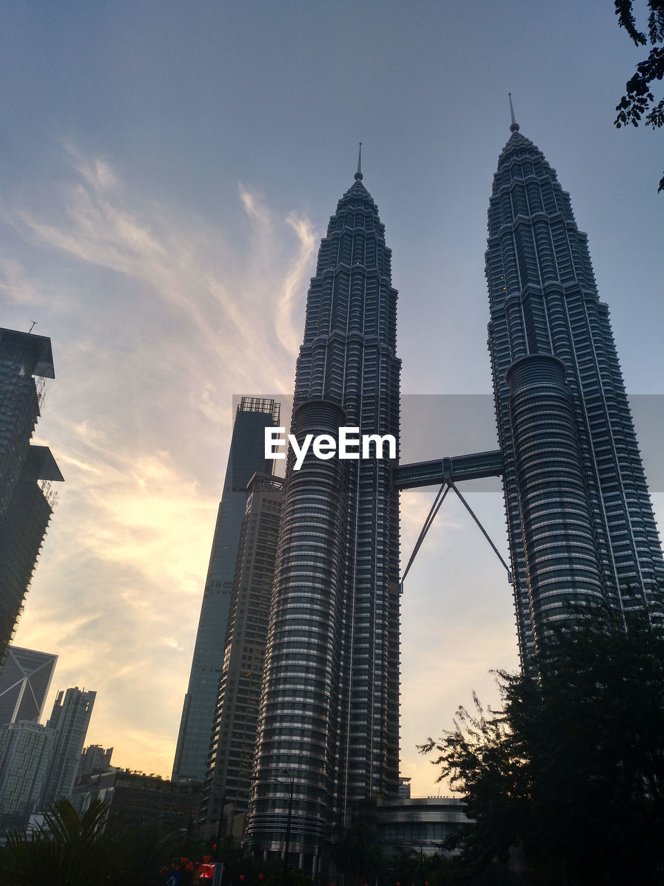 Low angle view of buildings against sky during sunset