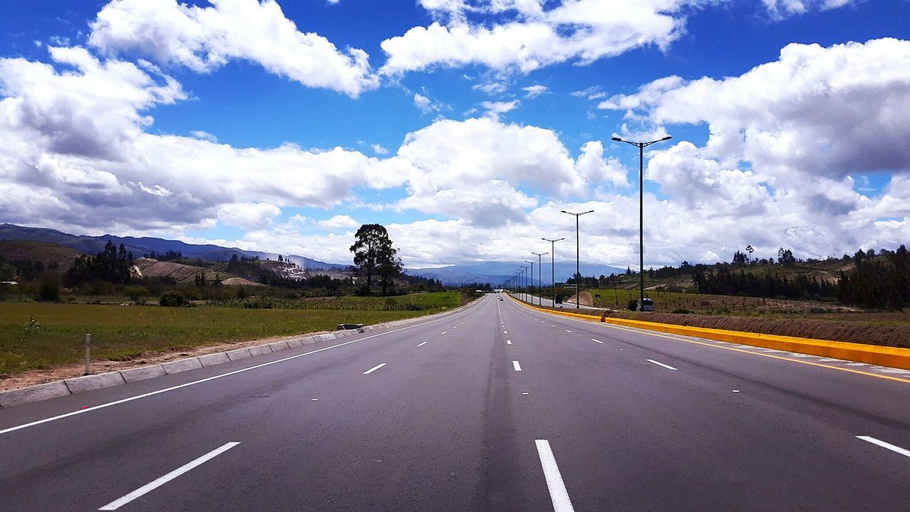 Empty road passing through countryside