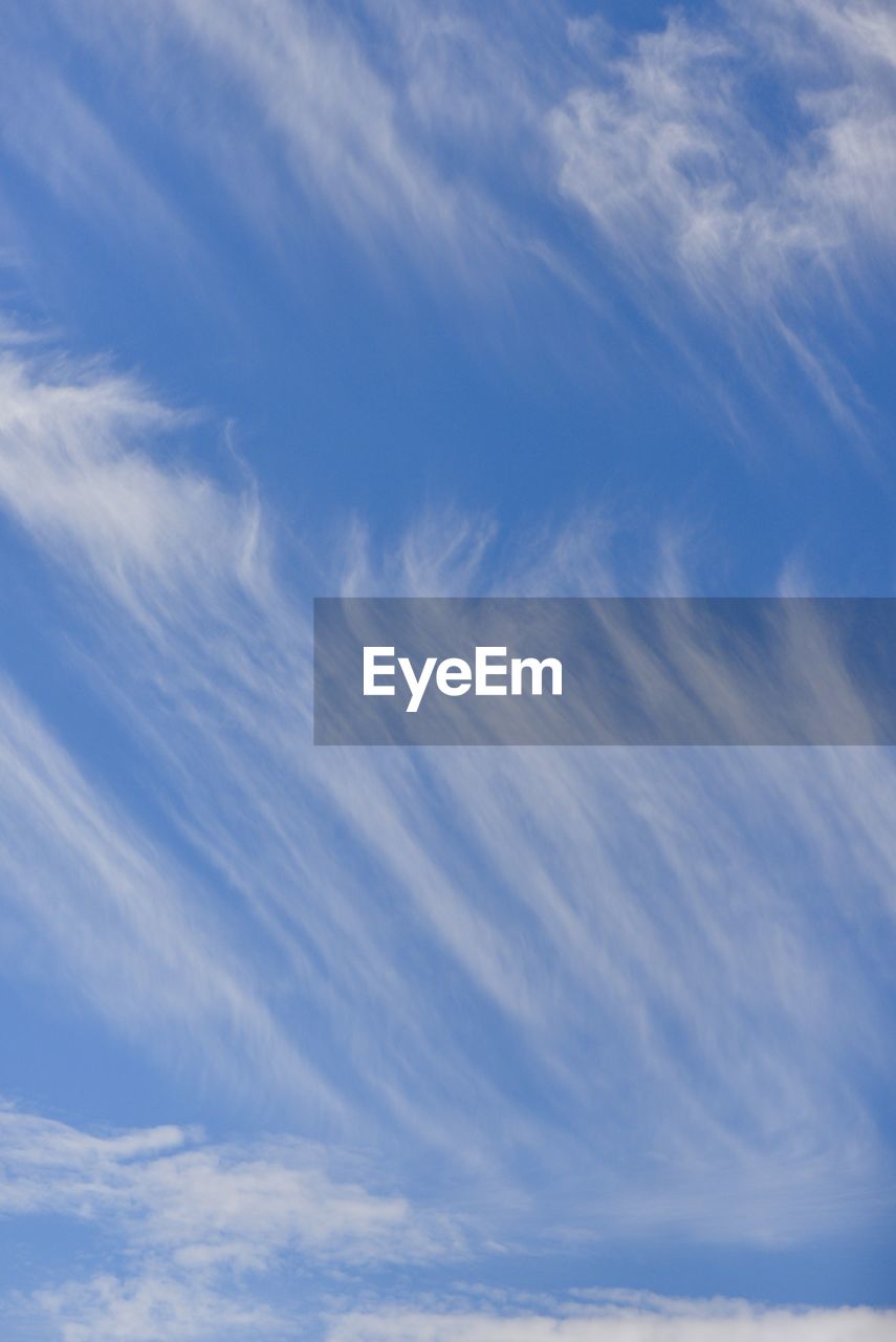 LOW ANGLE VIEW OF CLOUDS IN BLUE SKY